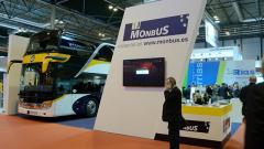 Stand de Monbus con autobús Setra Comfort Class S 517 HD en Fitur